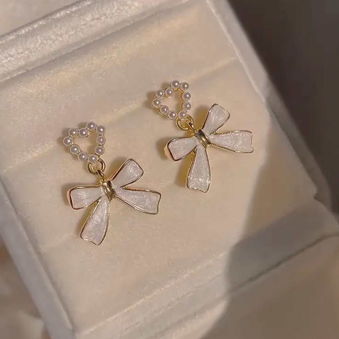 Charmed Heart Bow Earrings.